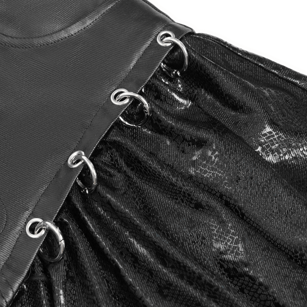 Close-up of edgy high-waisted mini skirt featuring snake print and metal ring accents.