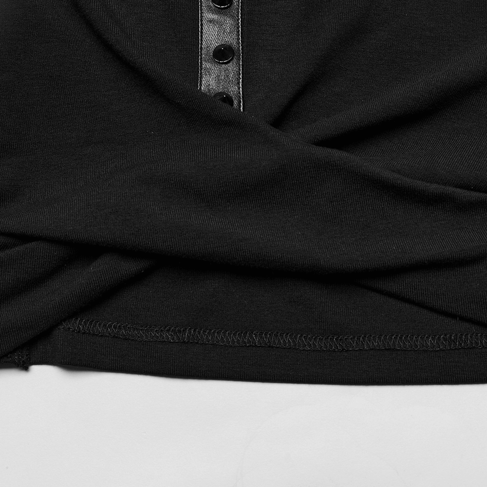 Close-up of the edgy hooded cropped top's fabric and button details, showcasing its stylish pleated design.