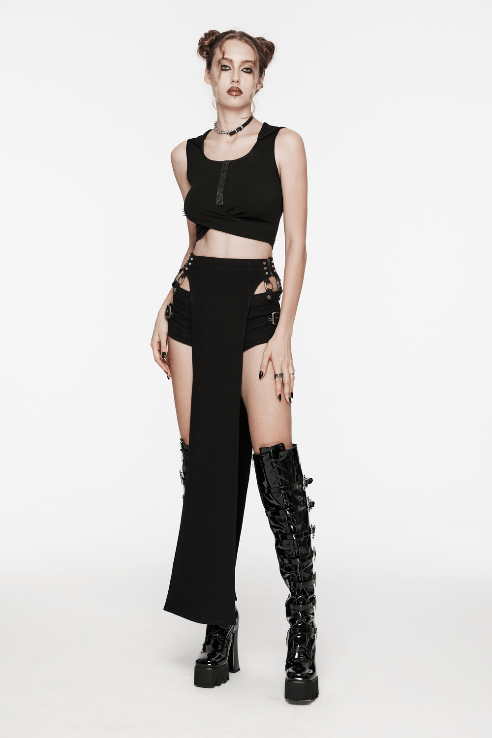 Edgy hooded cropped top with pleated cross design, perfect for urban chic style. Sleek and bold fashion statement.