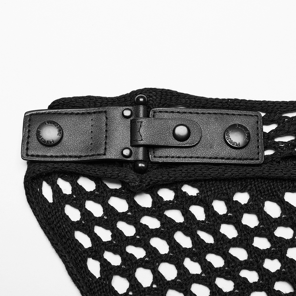 Close-up of a black knit techwear dress buckle detail, showcasing its edgy design and intricate texture.