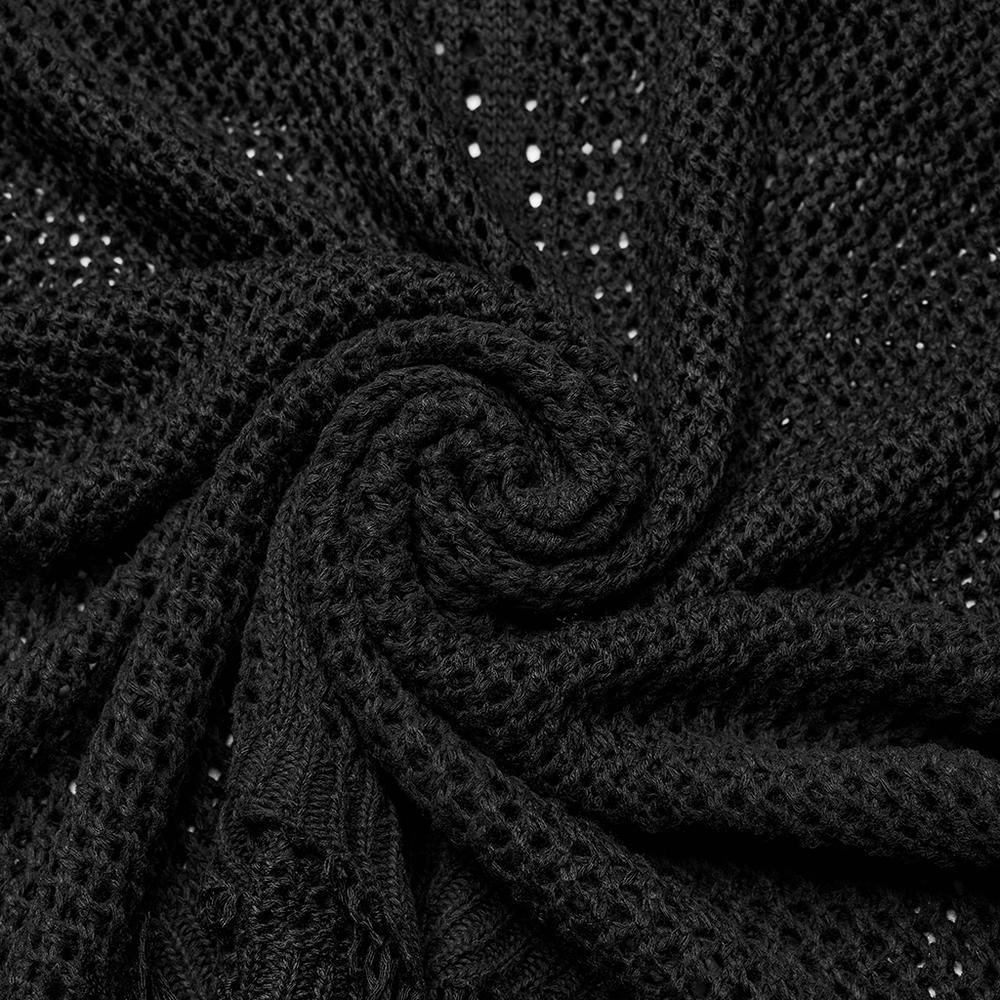 Close-up of textured black knit fabric showcasing a spiral pattern, perfect for edgy techwear styles.