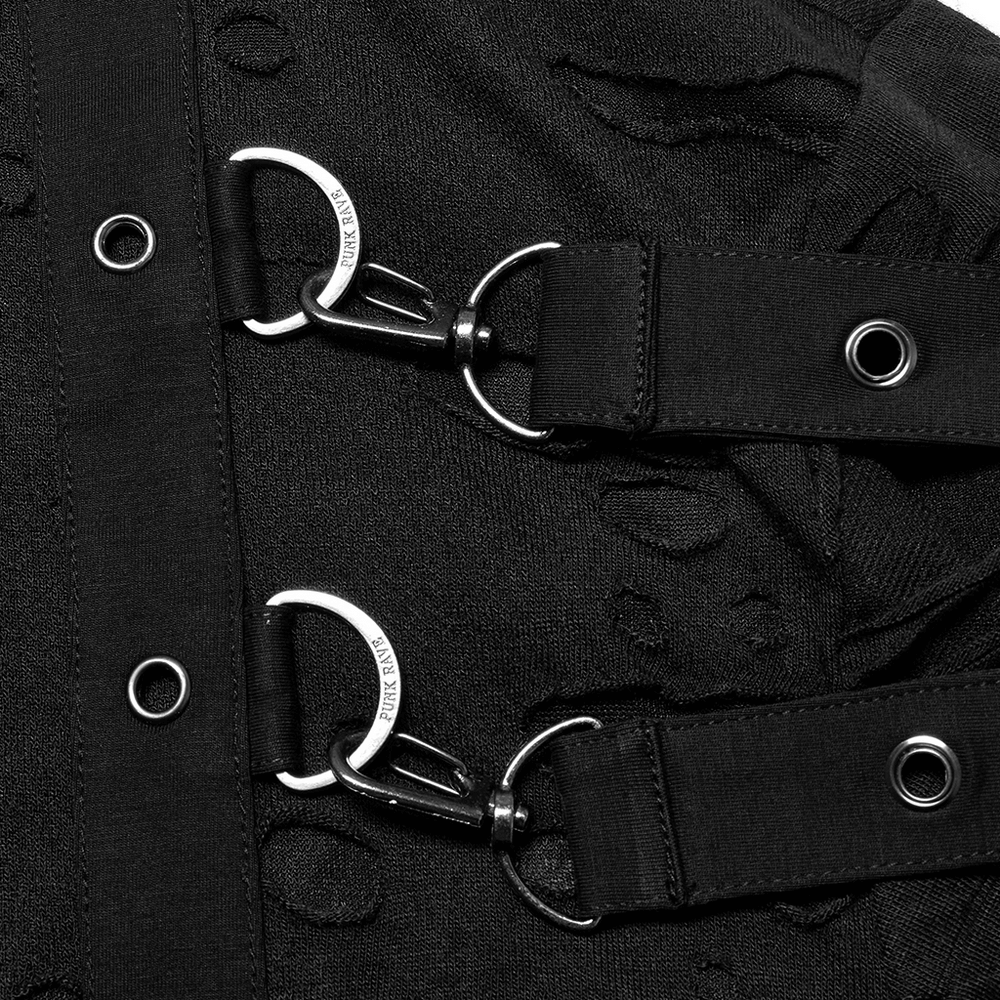 Close-up of edgy knitted top featuring destructed holes and adjustable loops with metal clasps.