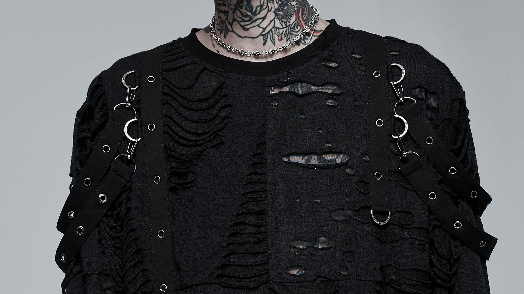 Edgy black long sleeve top with destructed holes, loops, and unique textures for goth style.