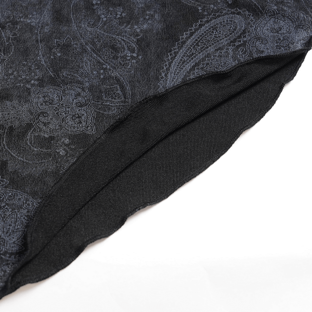Detail of the Edgy Lace-Up Blouse with Rose Trim and Bell Sleeves featuring paisley panel and intricate fabric texture.