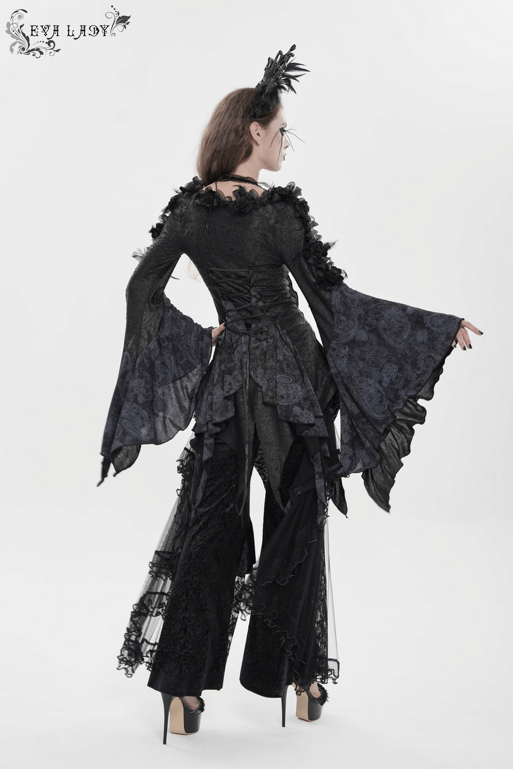 Edgy Lace-Up Blouse with Rose Trim and Bell Sleeves worn by model showcasing the dramatic flared sleeves and unique design.