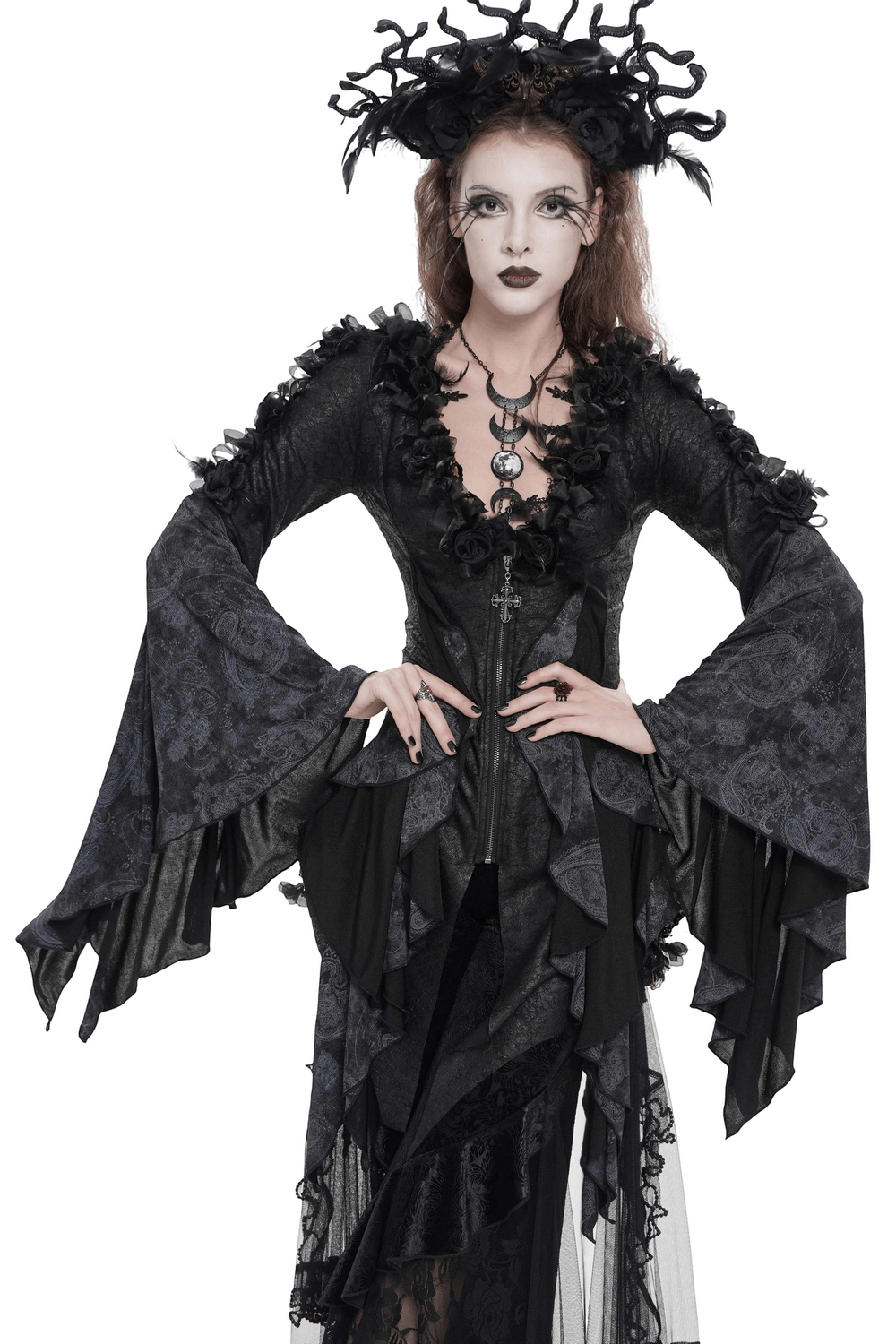 Edgy Lace-Up Blouse with Rose Trim and Bell Sleeves worn by a model in a gothic style with dramatic flared sleeves.