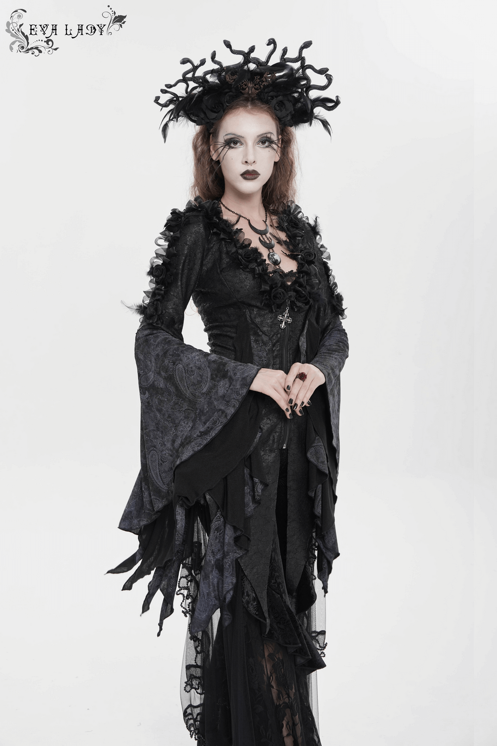 Edgy Lace-Up Blouse with Rose Trim and Bell Sleeves worn by a model with gothic style and dramatic accessories.