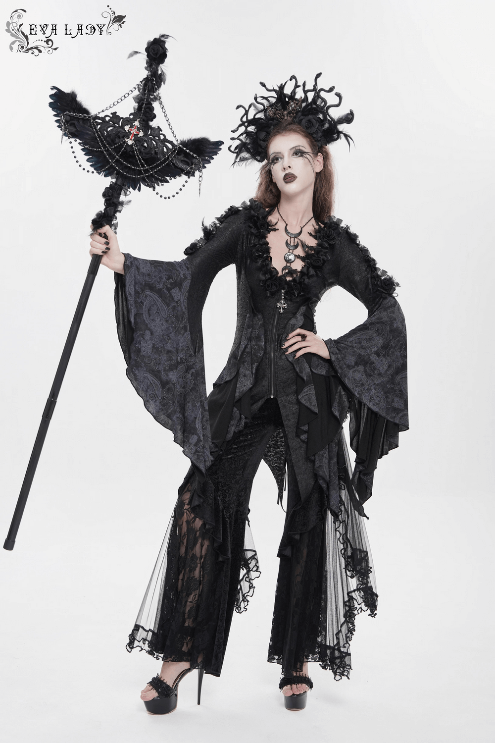 Edgy Lace-Up Blouse with Rose Trim and Bell Sleeves worn in a gothic style with dramatic flared sleeves and a corset-inspired design.