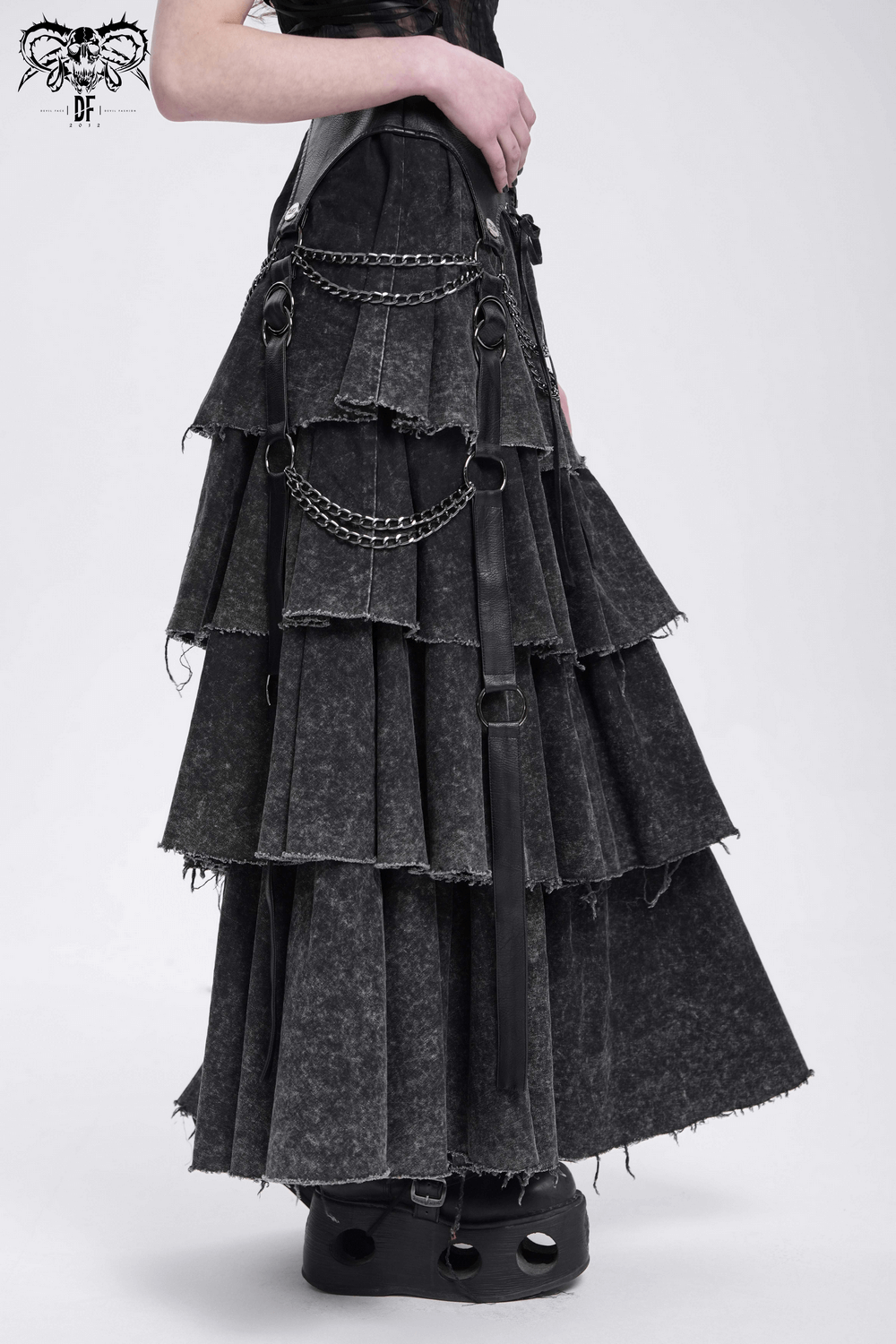 Edgy layered gothic skirt with chains and lace-up details, perfect for bold festival looks.