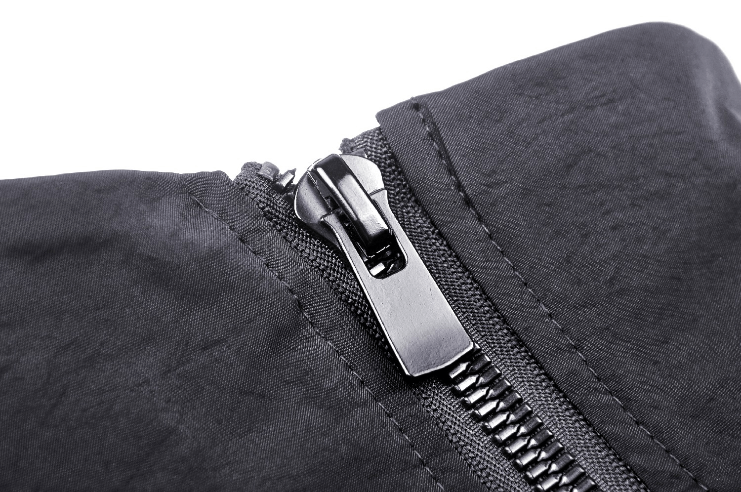 Close-up of black zipper on an edgy long sleeves cropped jacket, perfect for a punk street style look.