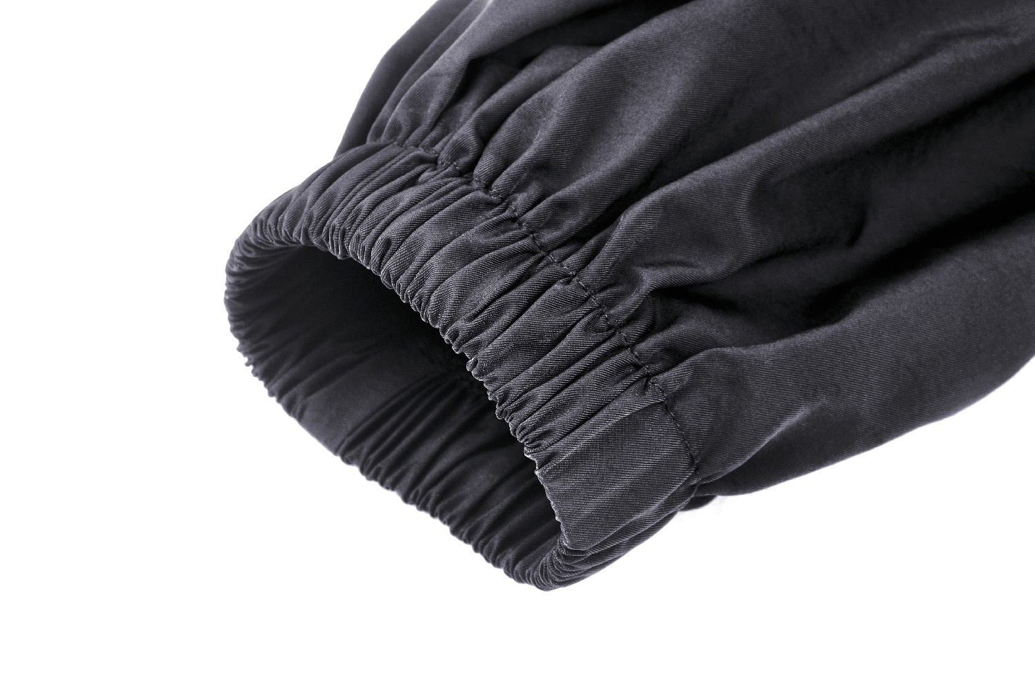Close-up of the elastic cuff on an edgy black long sleeve cropped jacket.