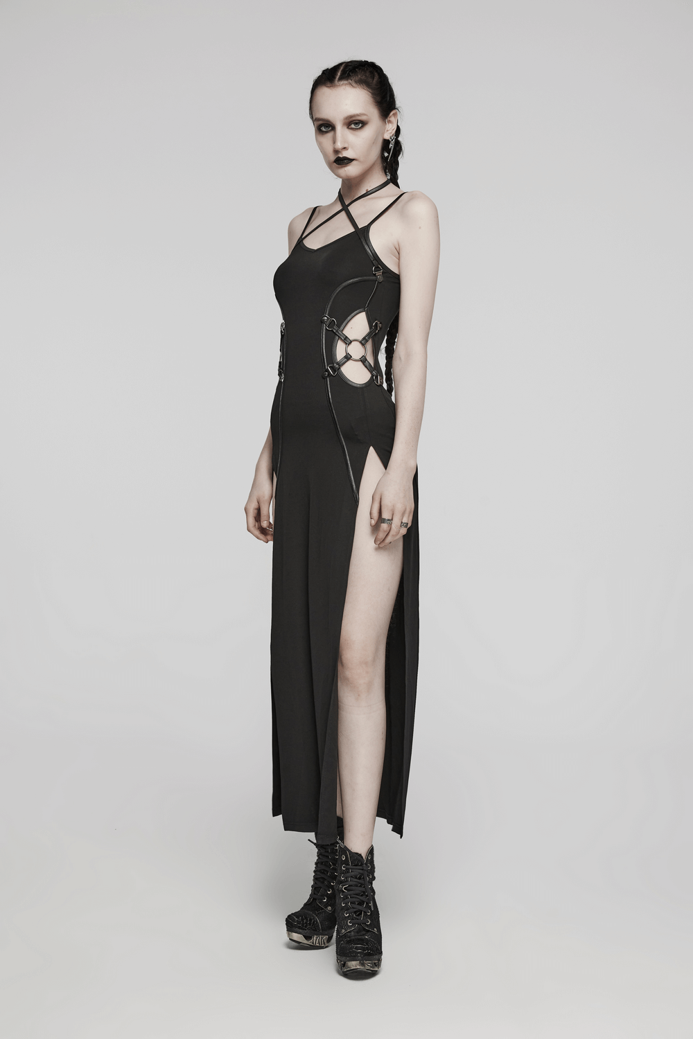 Punk style black dress with slits and lace-up details, showcasing a bold gothic fashion look.