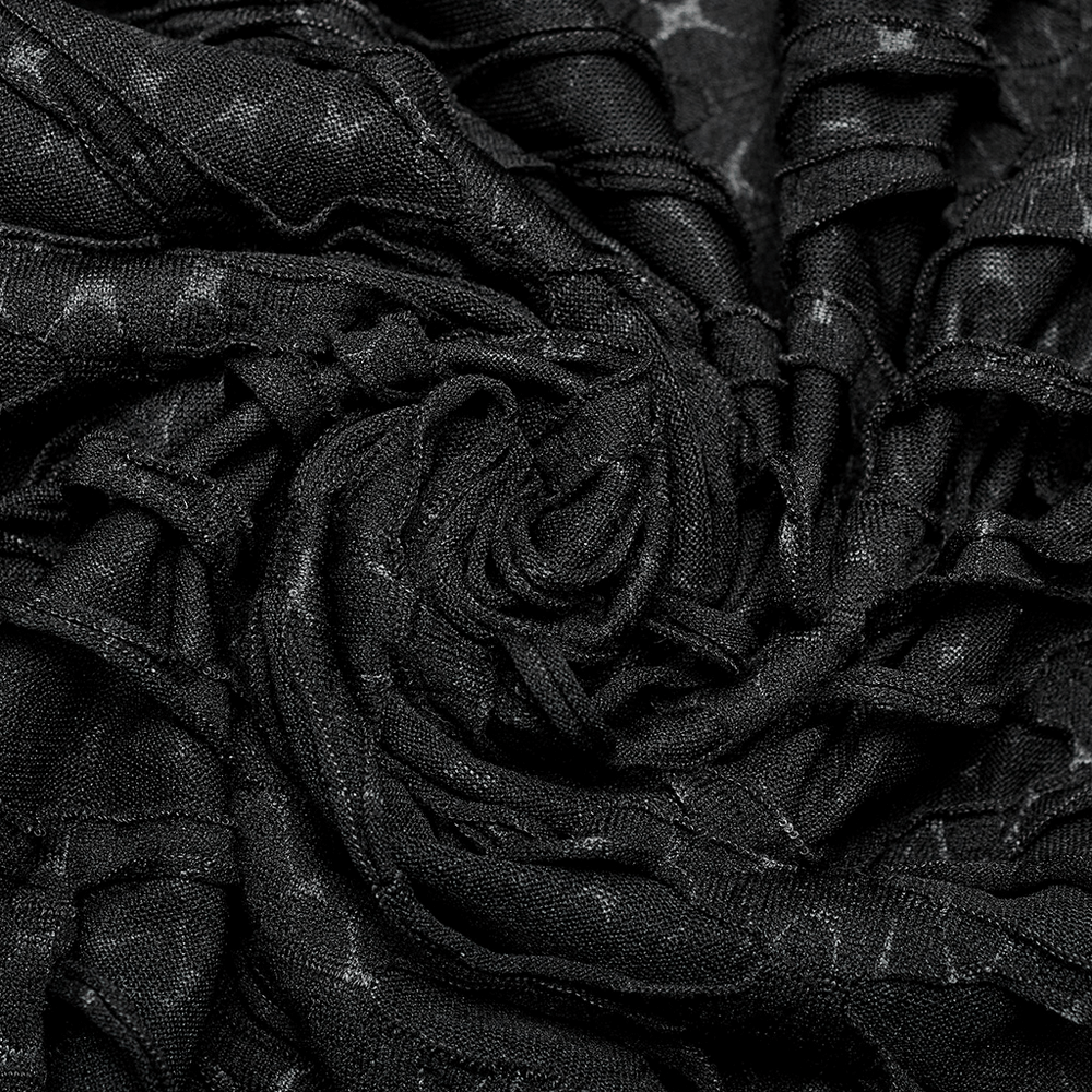 Close-up of black asymmetric mesh fabric showcasing edgy texture for gothic style.