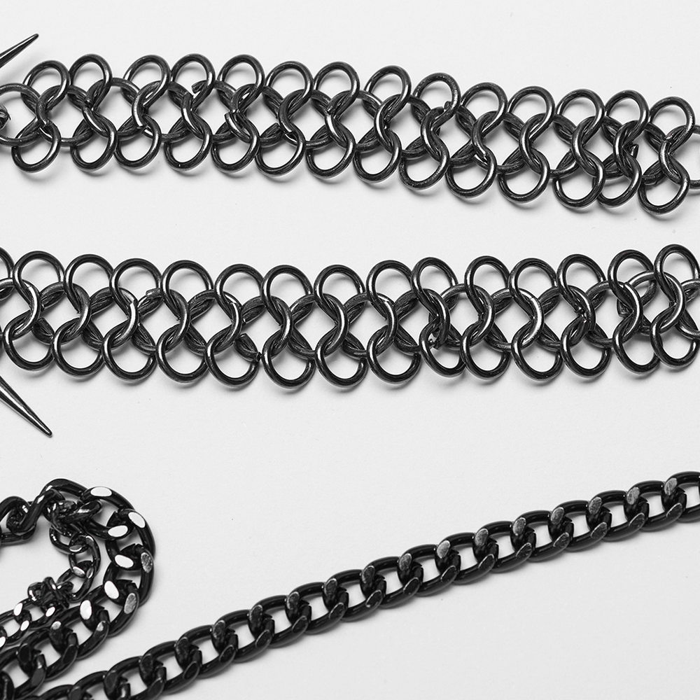 Close-up of black metal chains showcasing unique interlocking designs, perfect for edgy fashion.