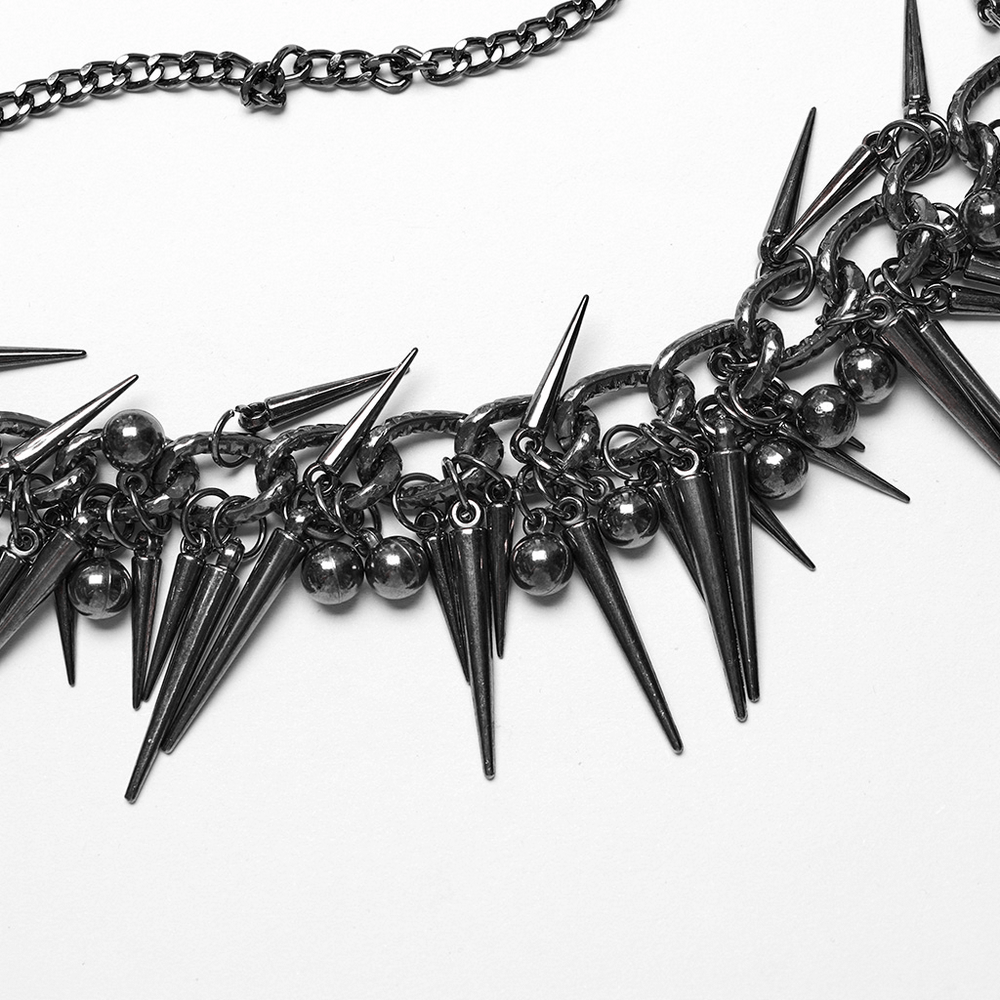 Edgy metal chain harness featuring spike and rivet detailing for a bold punk fashion statement.