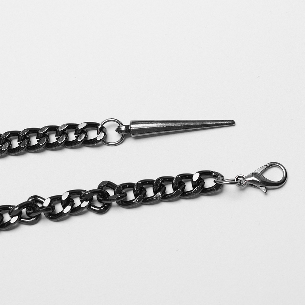 Close-up of edgy metal chain harness showcasing rivet detailing and clasp, perfect for a bold fashion statement.