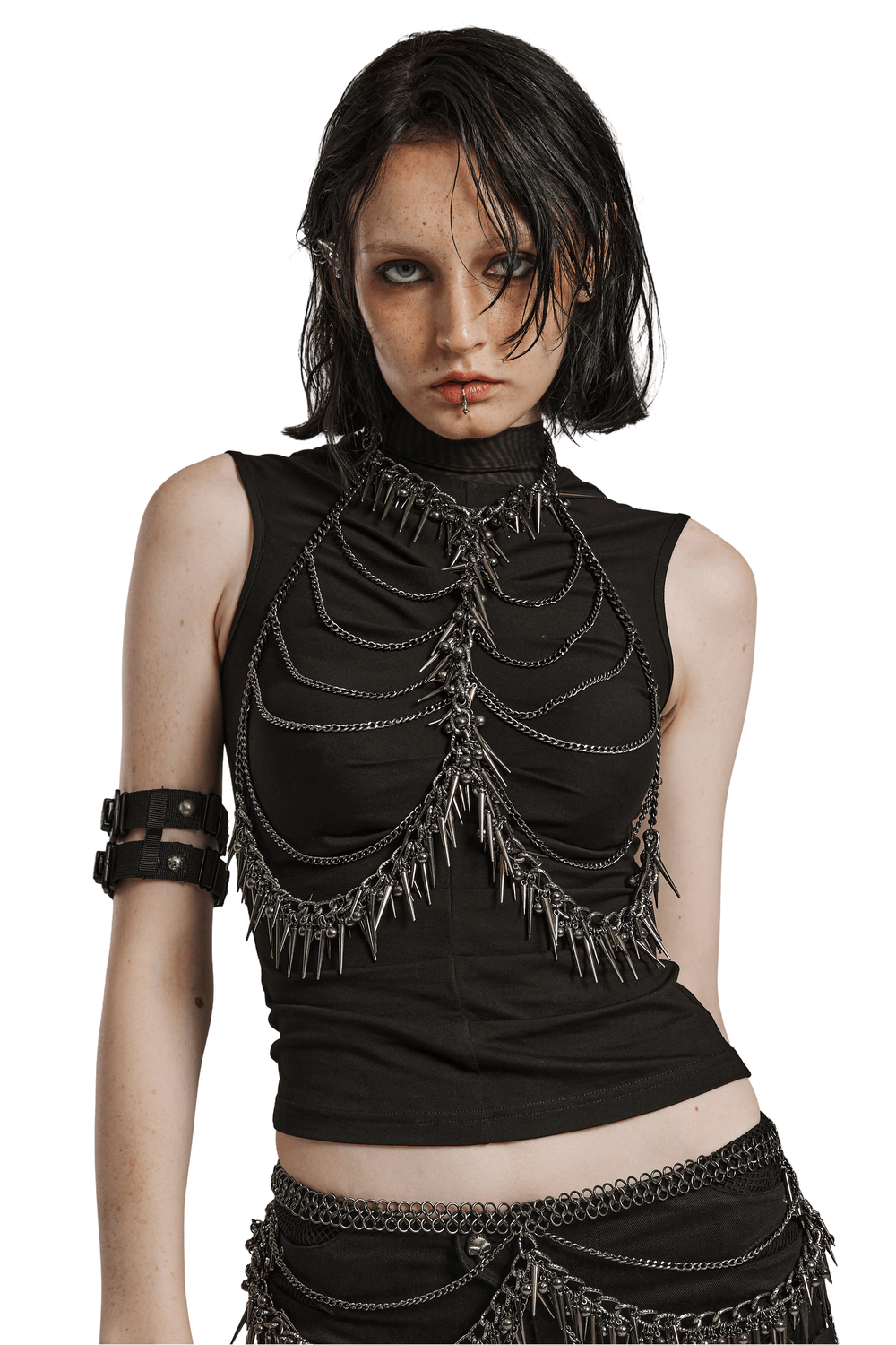Edgy metal chain harness top with rivet detailing, perfect for punk fashion lovers, enhancing bold style.