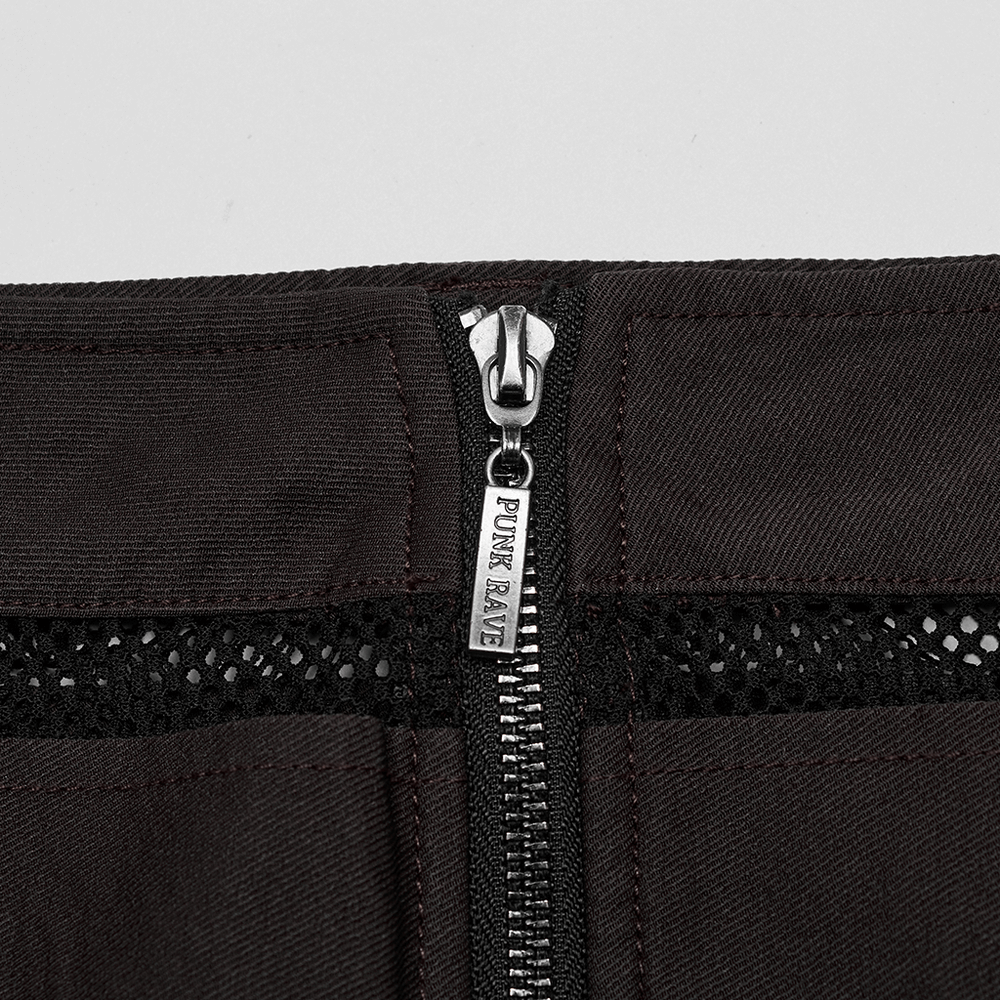 Close-up of edgy mini denim skirt showing zipper and diamond mesh pockets for a punk rock style.