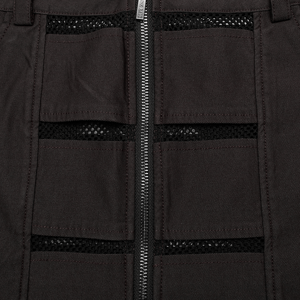 Close-up of edgy mini denim skirt featuring mesh pockets and zipper for a punk rock look.