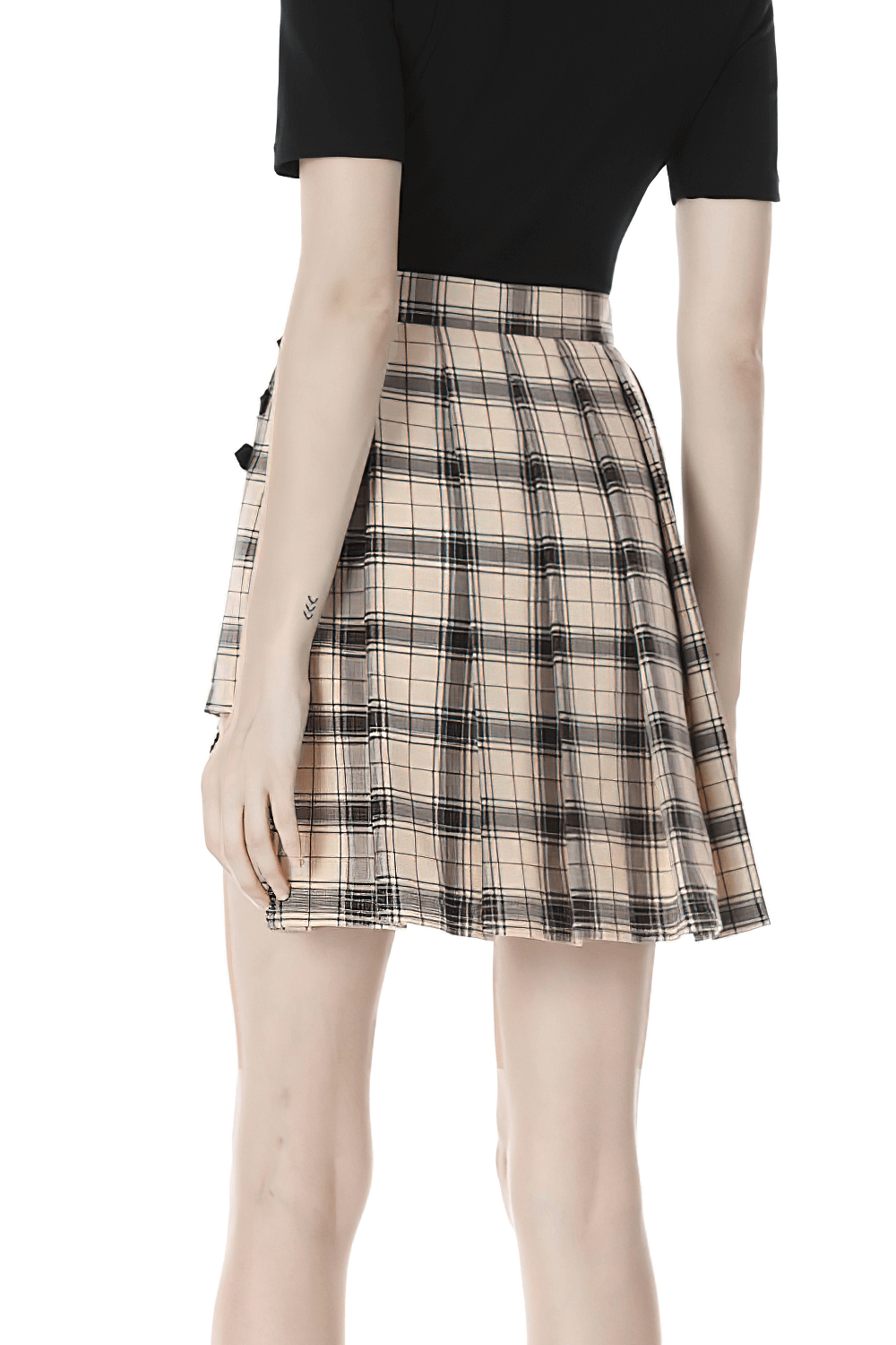 Trendy plaid asymmetrical skirt with bold buckles and stylish checkered pattern, perfect for making a fashion statement.