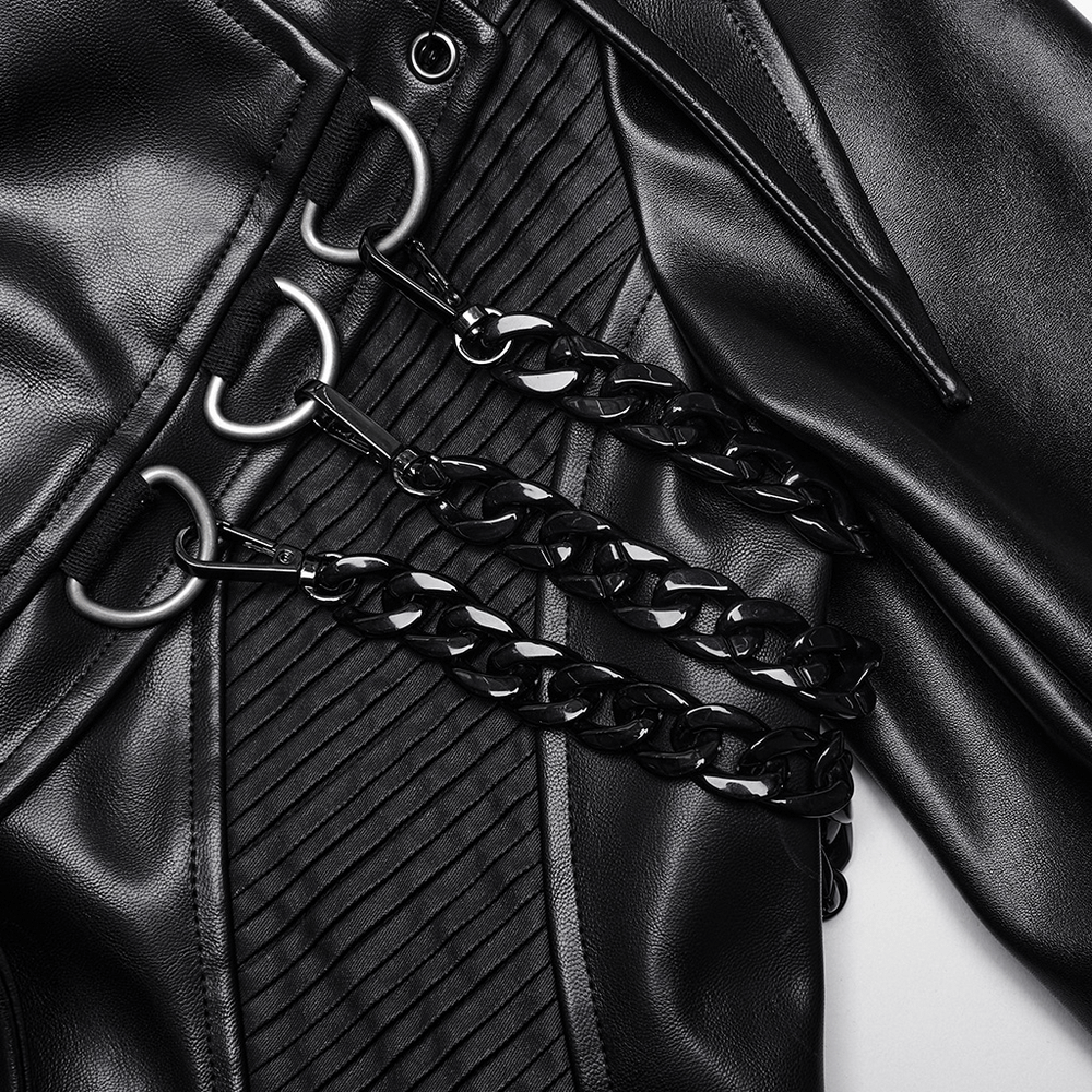 Close-up of edgy PU leather coat with bold chains and buckles, showcasing punk-inspired detailing.