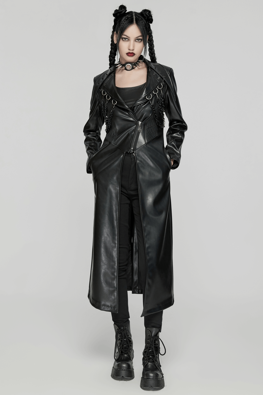 Edgy punk PU leather long coat with chains and buckles, highlighting a bold and rebellious style.