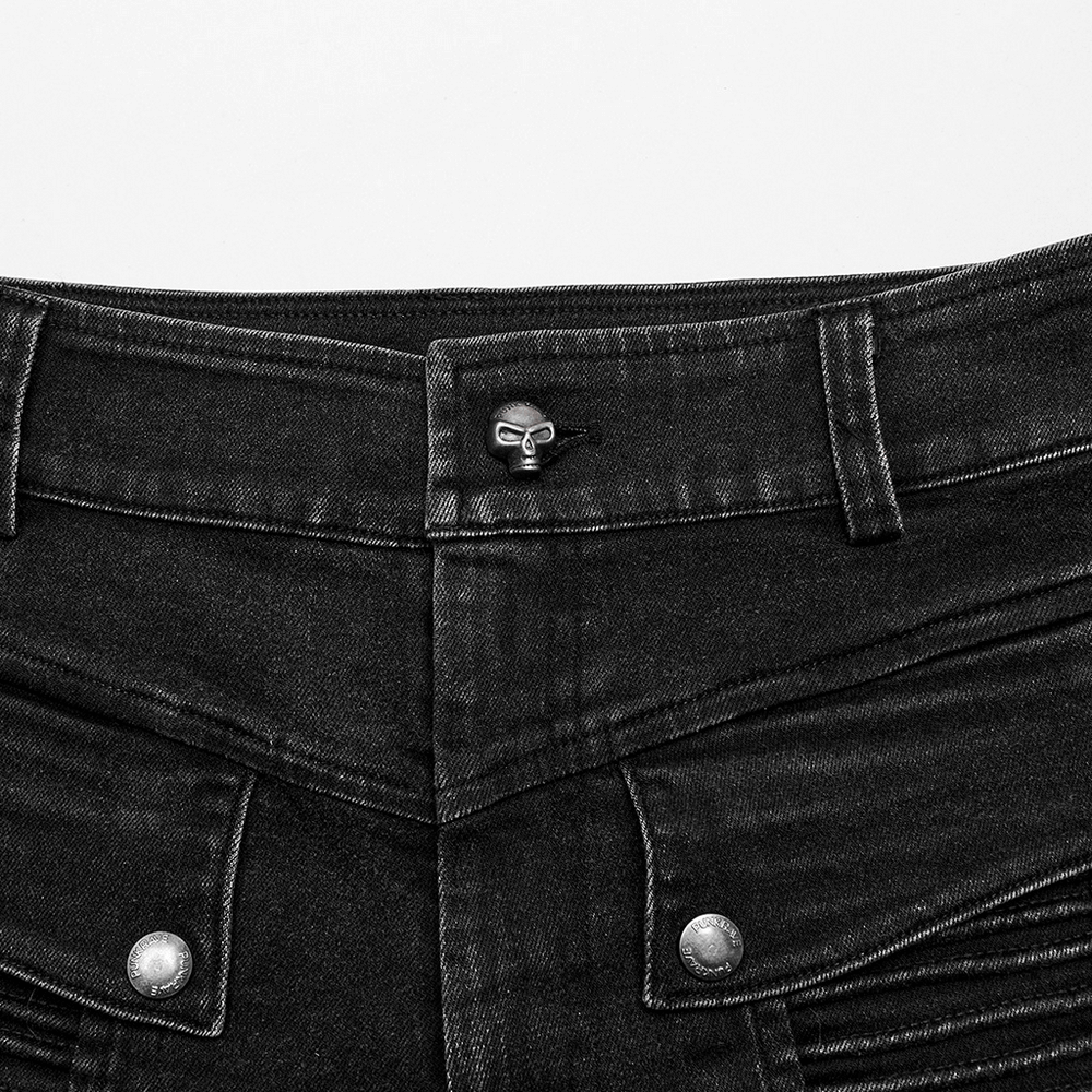 Close-up of the edgy punk black skinny jeans, featuring a unique skull button and stylish front pocket design.