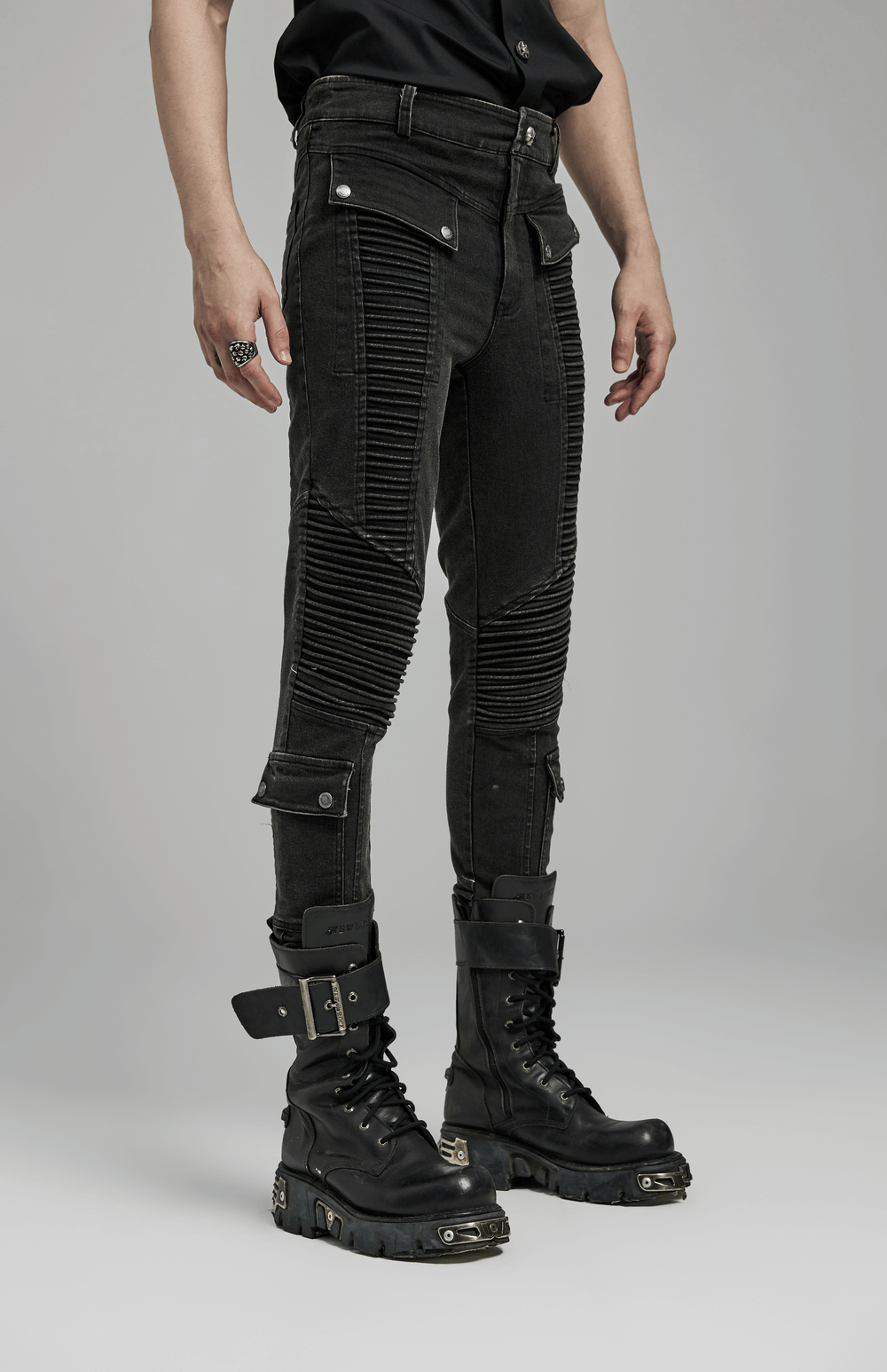 Edgy punk black skinny drawstring jeans for men with cool details and stylish boots.