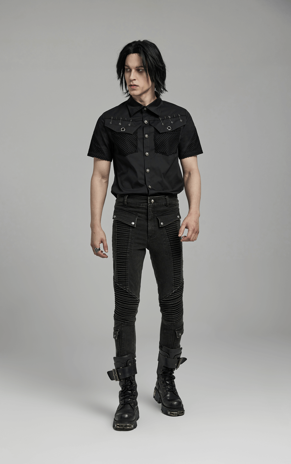 Men's edgy punk look featuring black skinny drawstring jeans and a stylish shirt for a cool vibe.