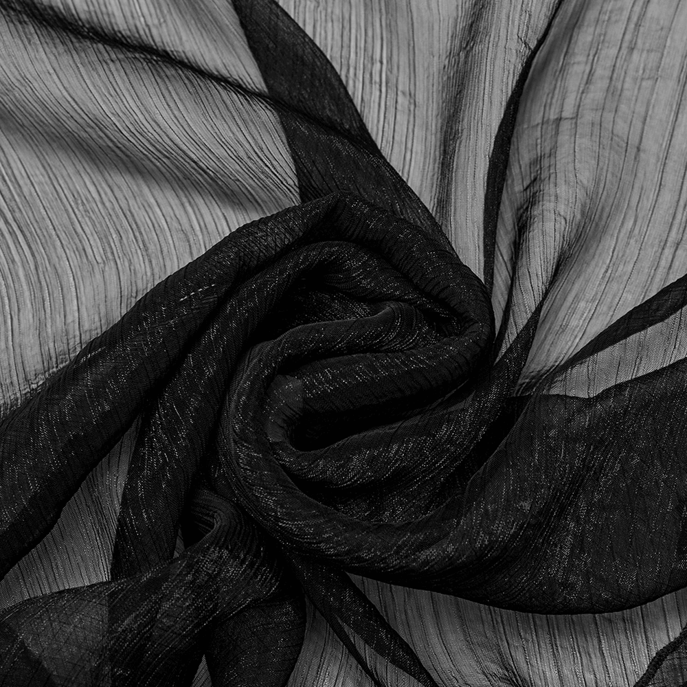 Close-up of luxurious black chiffon fabric, showcasing its textured elegance and flowing drape.