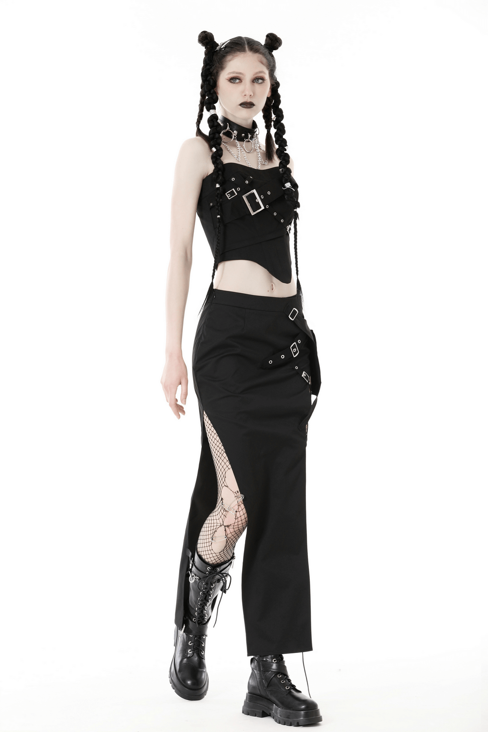 Edgy punk woman in a black corset top with buckles and high-waisted skirt, showcasing a bold fashion statement.