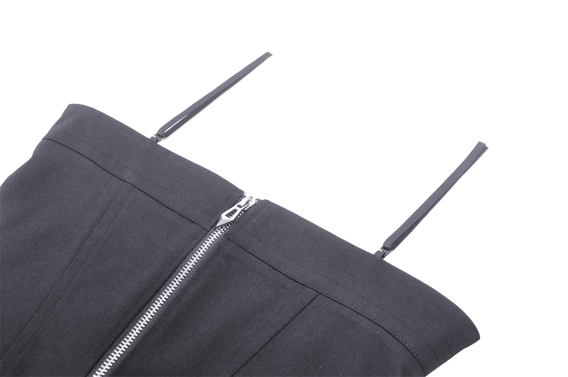 Close-up of an edgy black corset top with adjustable straps and zipper detail, perfect for a stylish look.