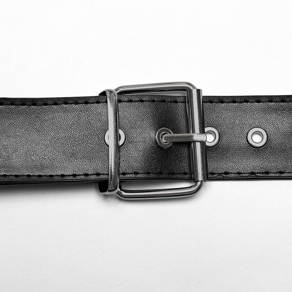 Close-up of a black PU leather harness buckle, featuring a silver roller loop and adjustable holes for a bold punk style.