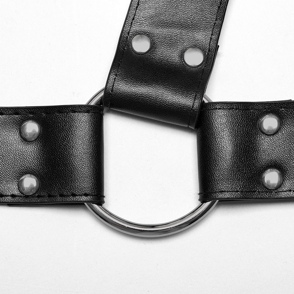 Close-up of edgy black PU leather harness with metal roller loop and snaps for punk style.