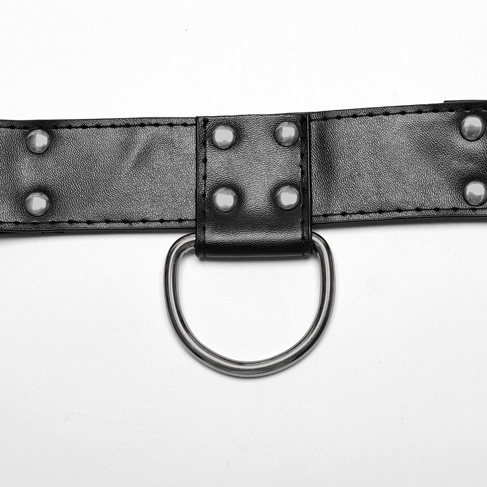 Close-up of edgy punk harness with roller loop and studded detailing for a bold fashion statement.
