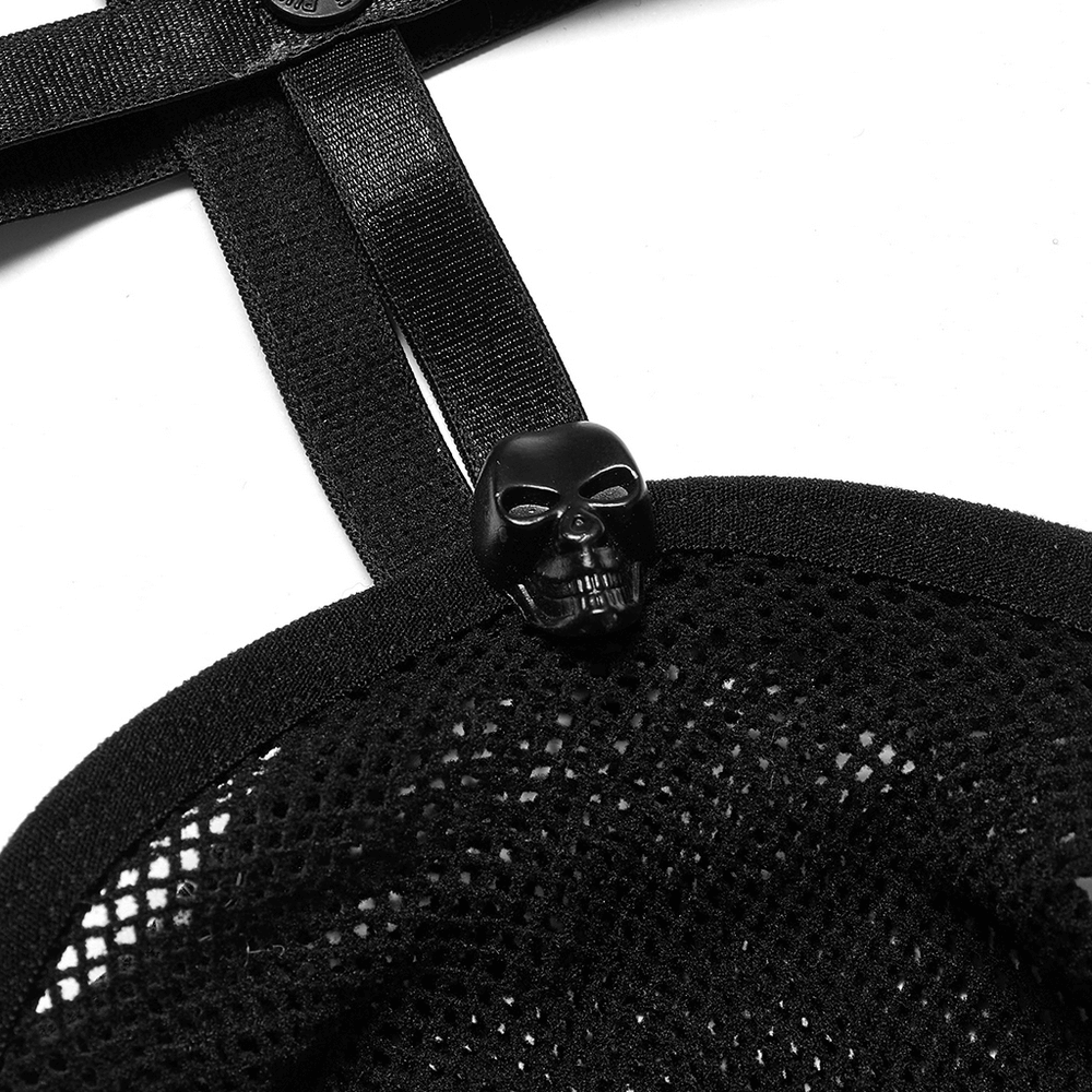 Close-up of black fishnet fabric with skull detail, showcasing edgy punk style and bold fashion statement.