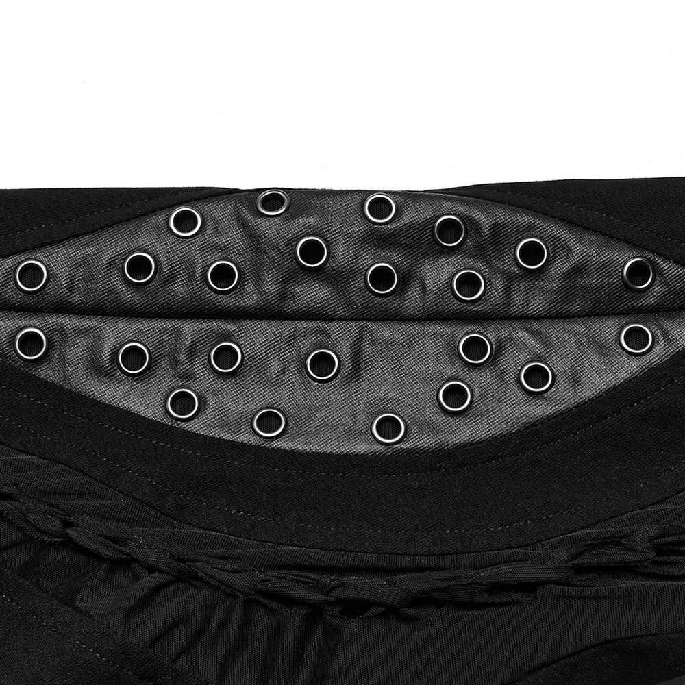 Close-up of edgy punk trousers with mesh fabric and metallic grommet details, showcasing unique design elements.