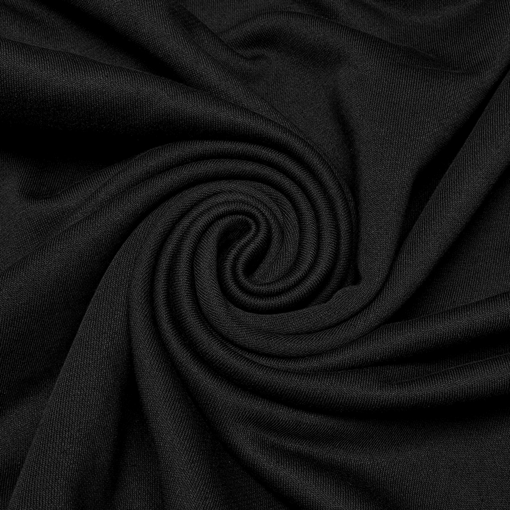 Close-up of black knit fabric swirl, perfect for edgy punk fashion statements with mesh sleeve contrast.