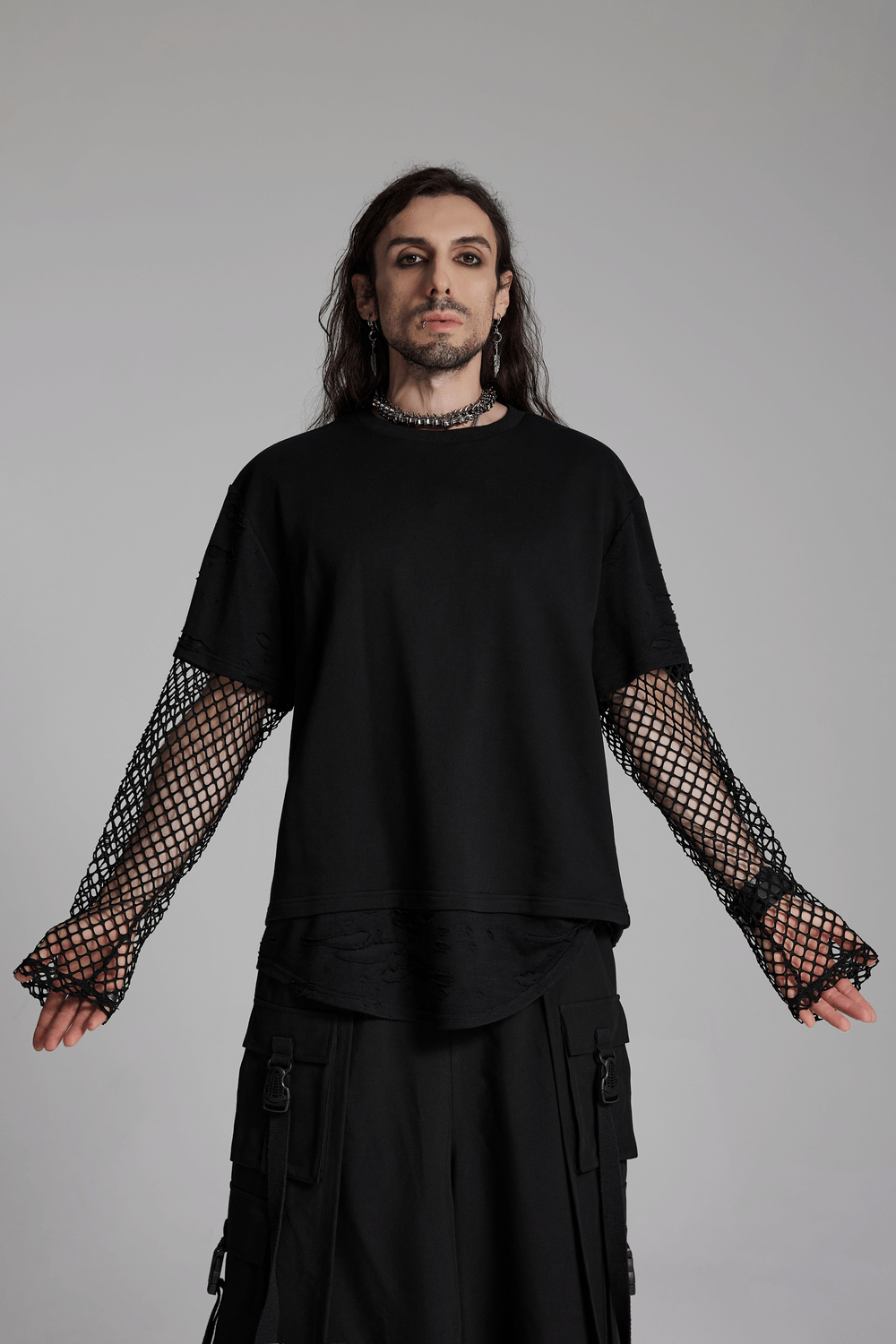 Edgy punk mesh-sleeved distressed top for men, featuring a relaxed fit with mesh panels and a rebellious streetwear style.