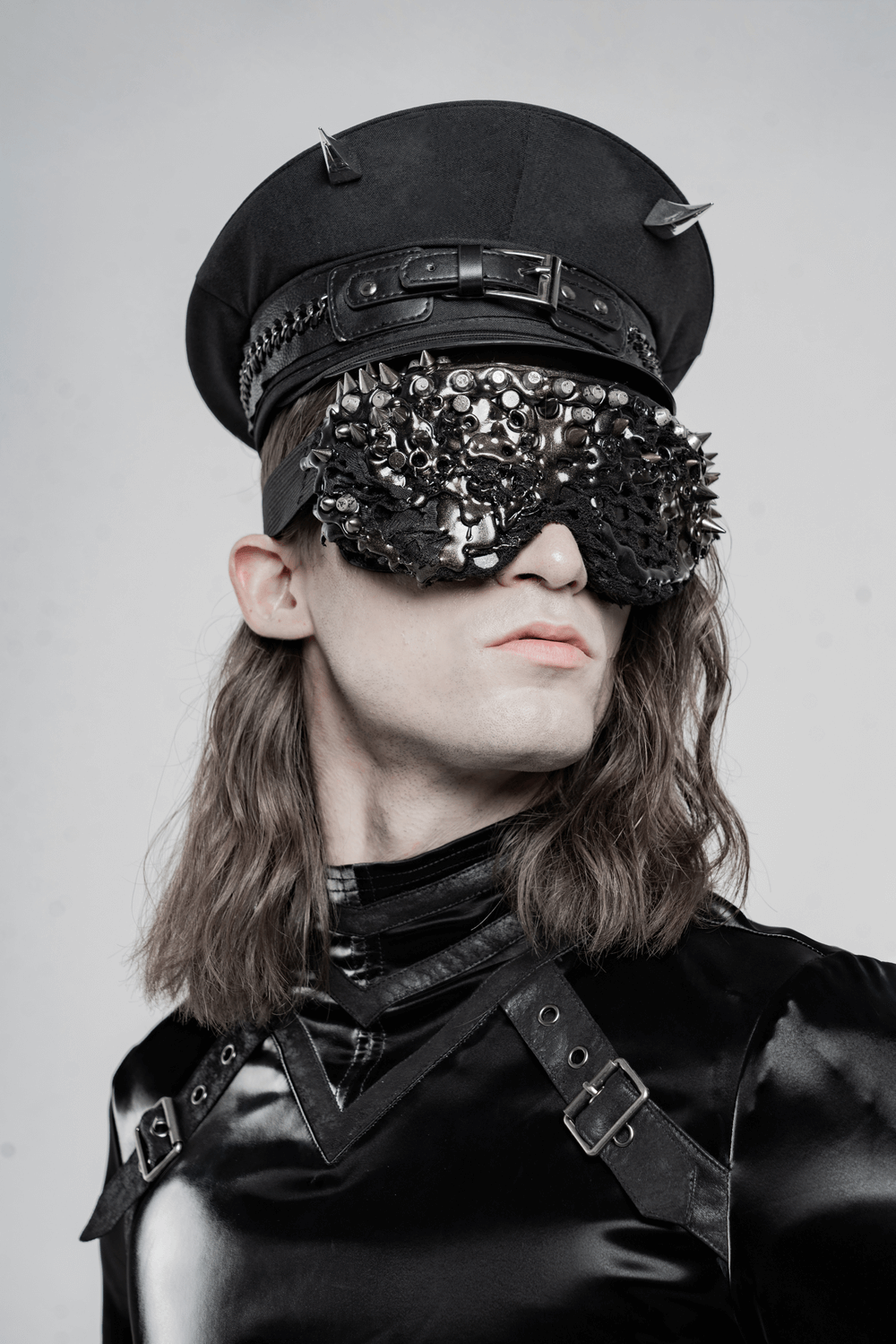 Model showcasing an edgy punk costume cap with spikes and stylish PU leather accents.