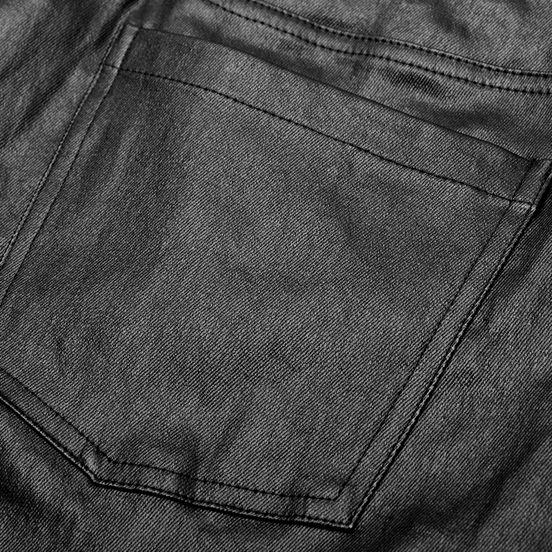 Close-up of a sleek black pocket on edgy punk faux leather trousers for men.