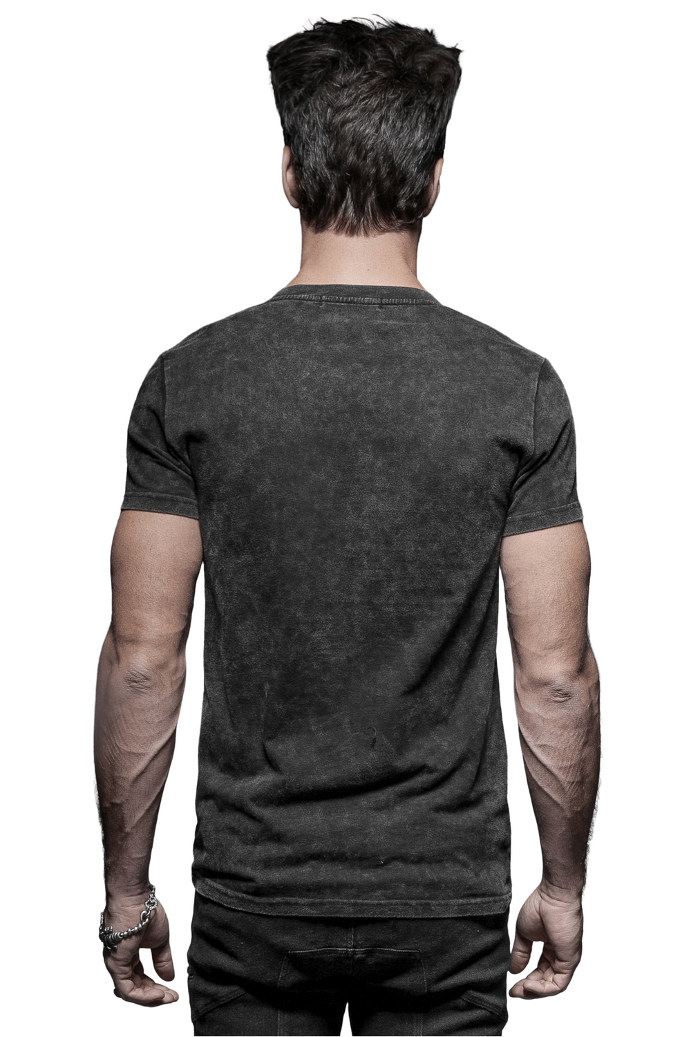 Back view of a man wearing an edgy black t-shirt with a vintage finish, showcasing a minimalist punk rock style.