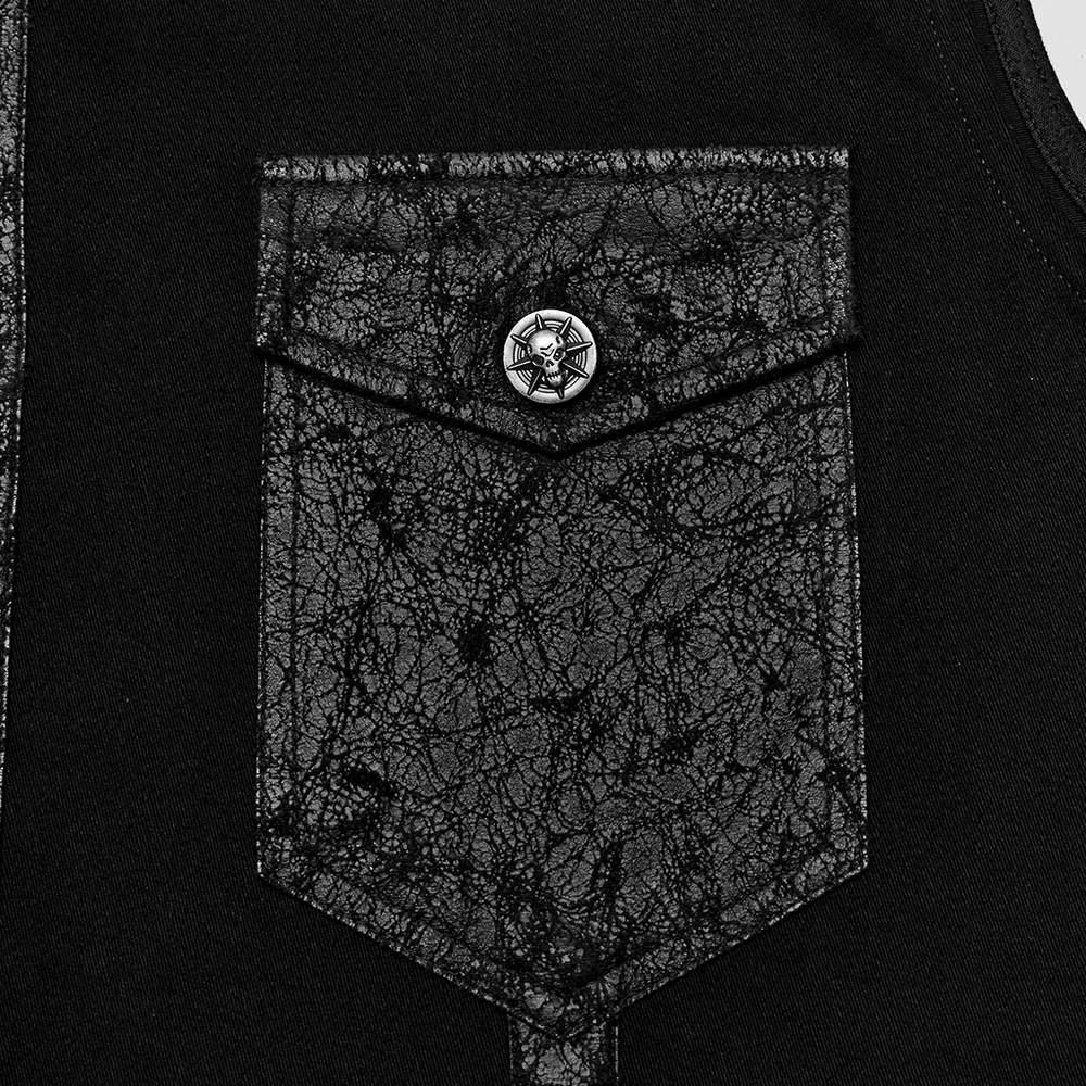 Close-up of an edgy black sleeveless shirt pocket with a textured design and a silver star button.