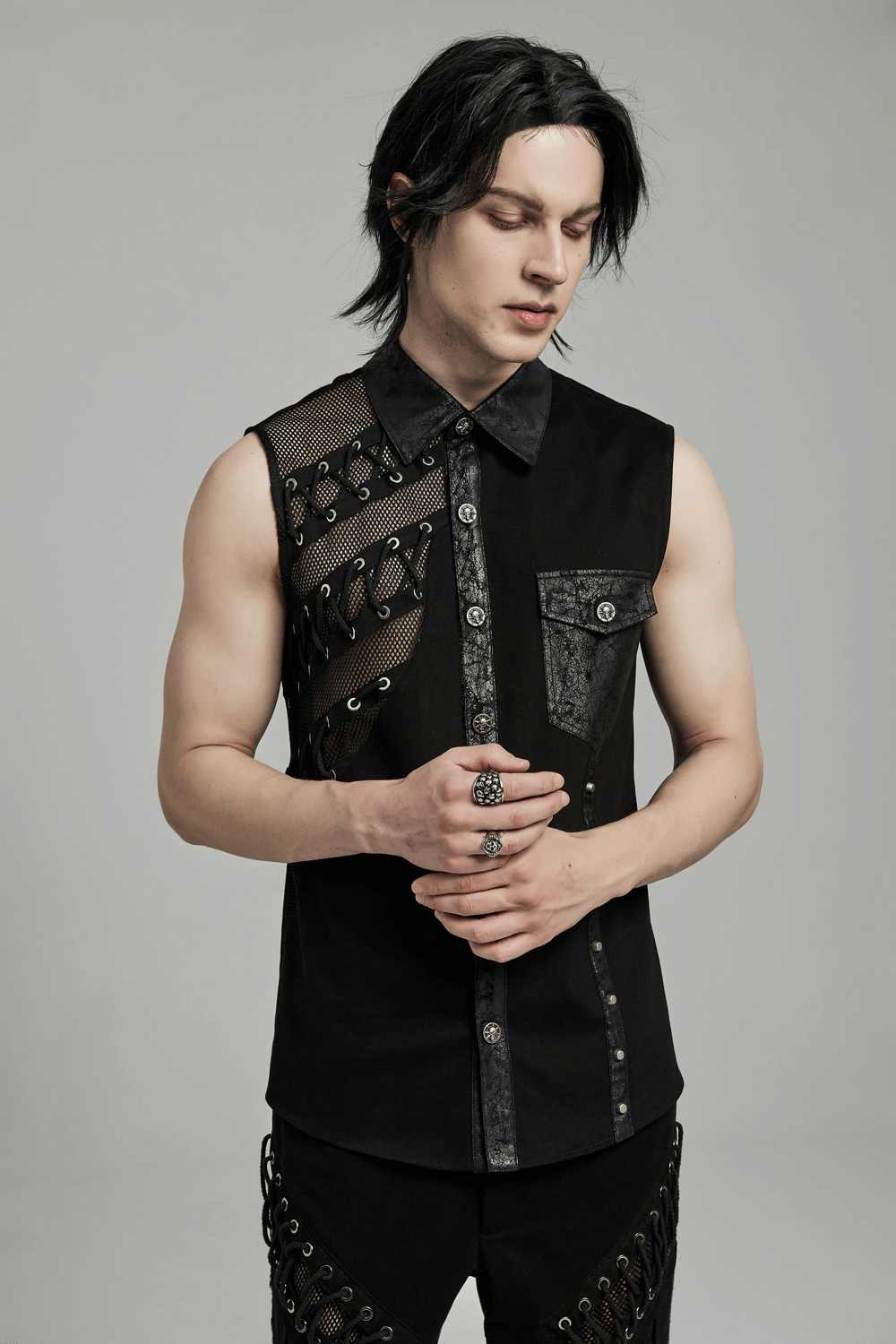 Edgy punk sleeveless asymmetric mesh shirt showcasing bold splicing and eye-catching details, perfect for urban style.