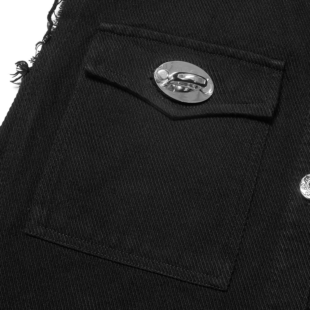 Close-up of a black sleeveless vest pocket with a shiny metal clasp, showcasing punk style and edgy fashion.