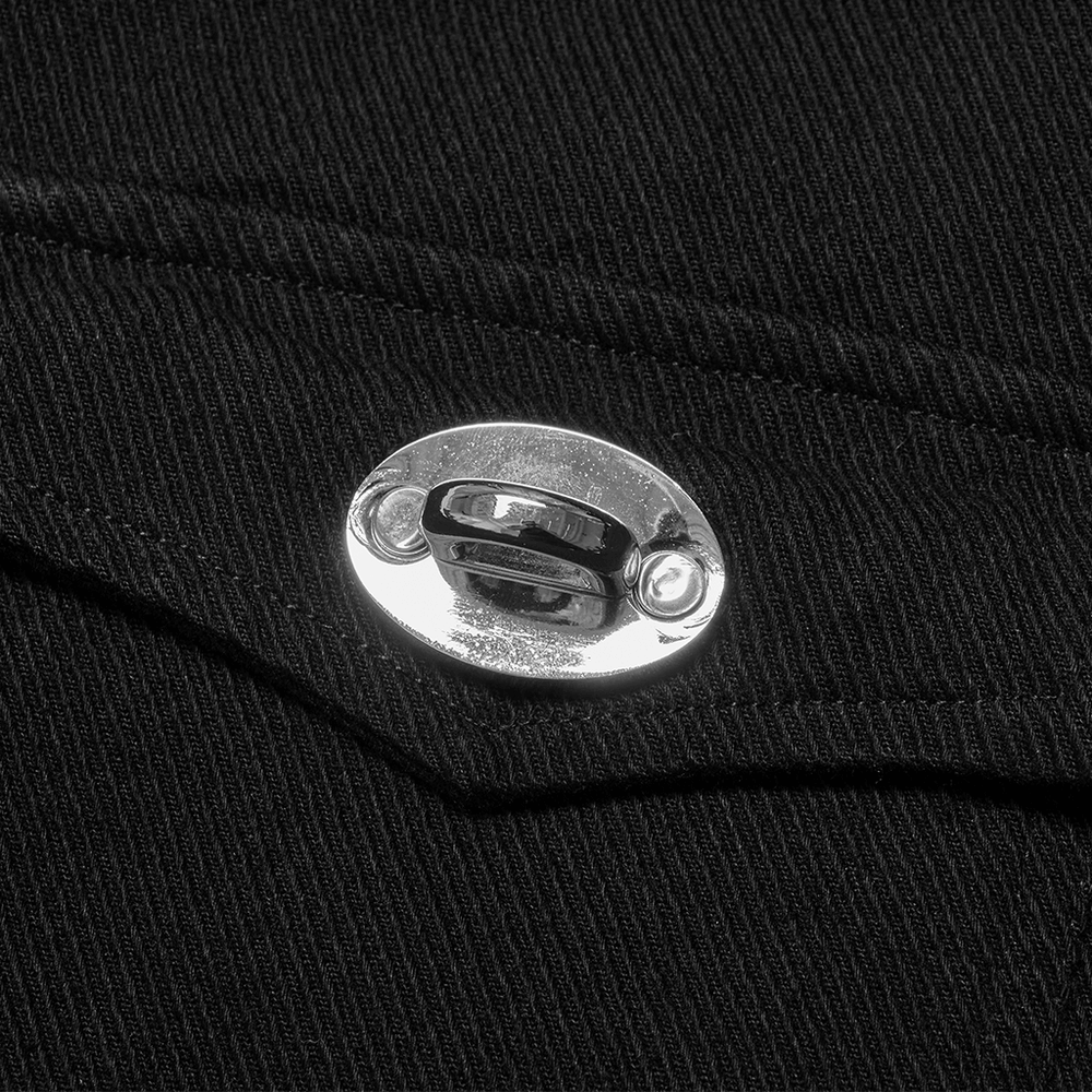 Close-up of metal buckle detail on black sleeveless punk vest, showcasing edgy fashion and studded elements.