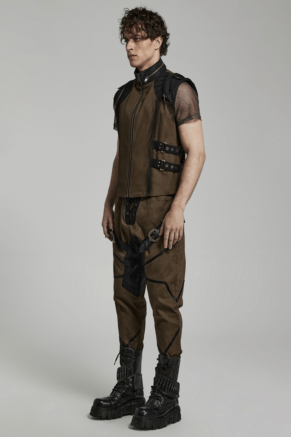 Edgy punk vest with zip and buckles, paired with stylish cargo pants and chunky boots in a modern fashion shoot.