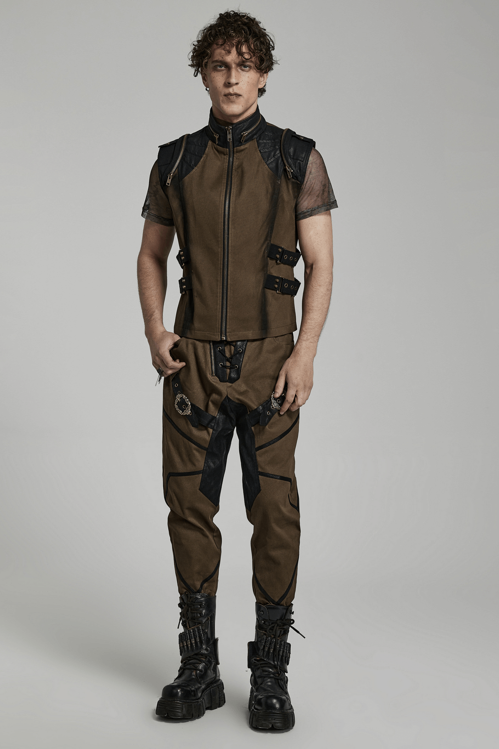 Edgy punk vest with zipper and buckles, paired with stylish pants, showcasing a bold street fashion look.