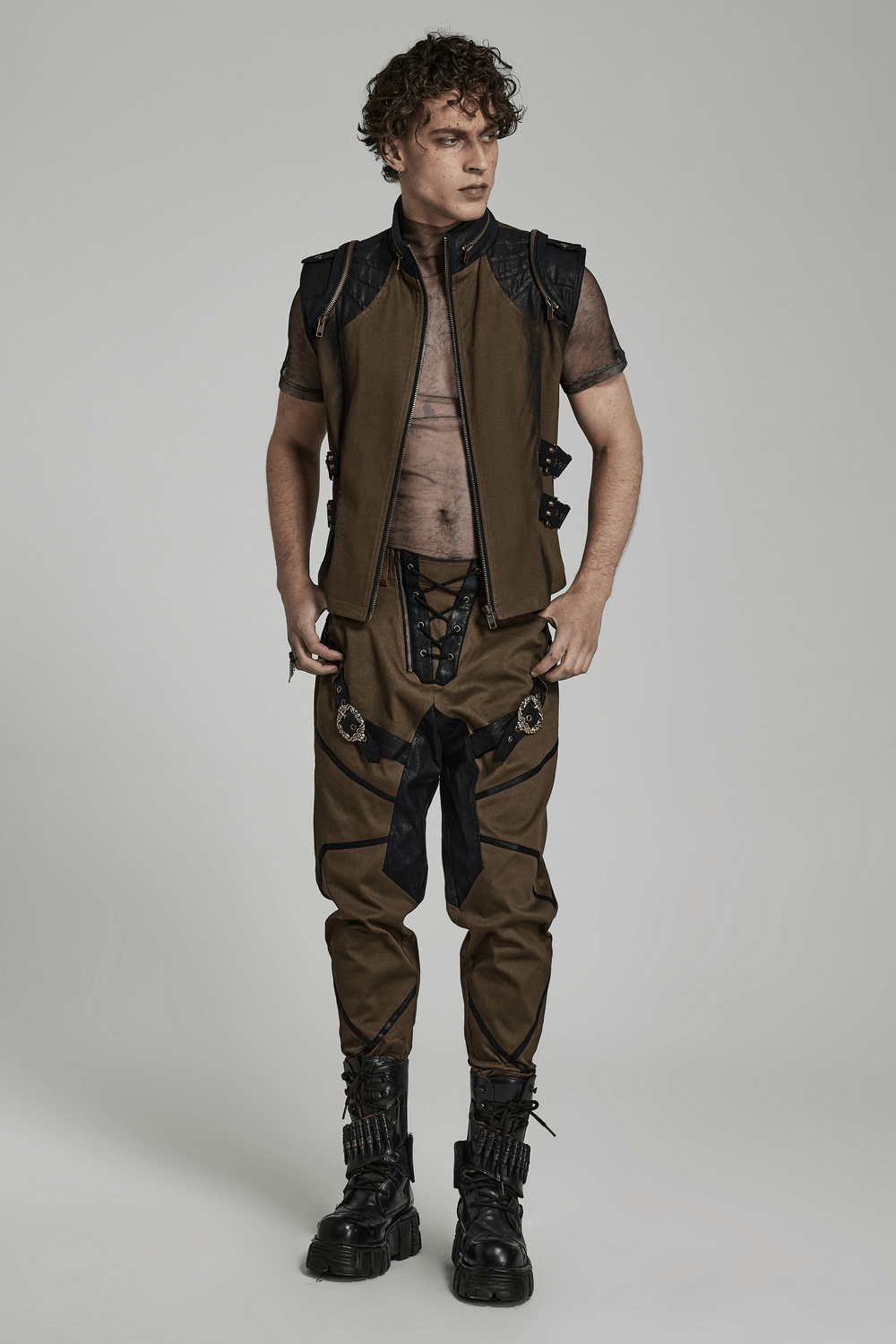 Edgy punk vest with zipper and buckles, paired with stylish lace-up pants, embodying bold, unconventional fashion.