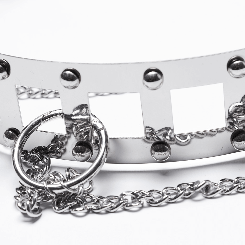 Close-up of edgy punk style silver chain belt with rivets and square hollow design, showcasing intricate details and craftsmanship.